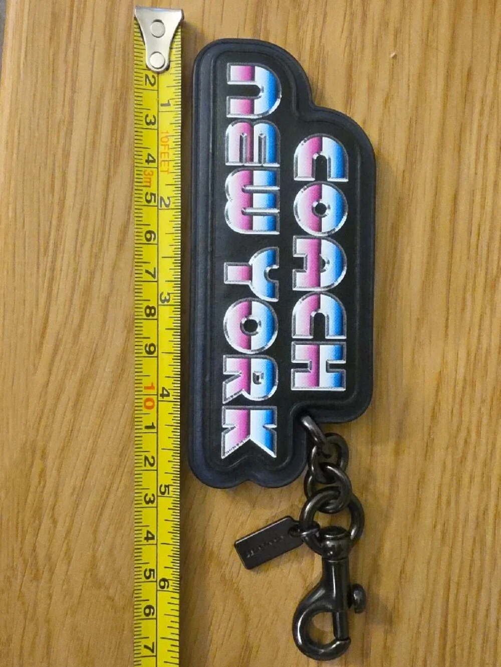 Coach Black Logo Keychain with Blue-Pink Gradient Lettering